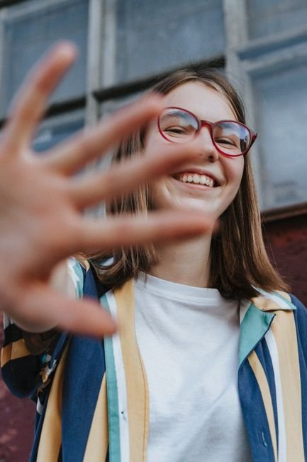 A smiling teenage girl outdoors